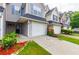 Charming townhouse with a one car garage and landscaped front yard offering curb appeal at 6726 Gallant Se Ct # 30, Mableton, GA 30126