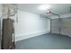 Clean garage with modern water heater and garage door opener at 6726 Gallant Se Ct # 30, Mableton, GA 30126