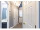 Bright hallway with a half bathroom, wood floors, and neutral paint at 6726 Gallant Se Ct # 30, Mableton, GA 30126