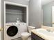 Bathroom with laundry includes a washer, dryer, toilet and sink at 6726 Gallant Se Ct # 30, Mableton, GA 30126