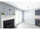 Open-concept room with modern flooring, fireplace, and a chandelier at 6726 Gallant Se Ct # 30, Mableton, GA 30126