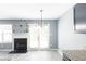 Bright room featuring fireplace, a chandelier, and new modern floors at 6726 Gallant Se Ct # 30, Mableton, GA 30126