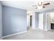 Bedroom features a ceiling fan, plush carpet, and access to walk-in closets and bathroom at 6726 Gallant Se Ct # 30, Mableton, GA 30126