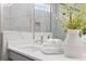 Bathroom featuring a white countertop, soft towels, and a decorative vase for a spa-like experience at 908 Catamaran Ct, Alpharetta, GA 30005