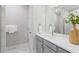 Bathroom featuring a bright, contemporary design with a white vanity and modern fixtures for a sleek look at 908 Catamaran Ct, Alpharetta, GA 30005