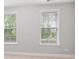 Bright bedroom with two large windows offering great natural light at 908 Catamaran Ct, Alpharetta, GA 30005