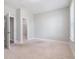 Spacious bedroom with neutral carpet, paint, and a walk in closet at 908 Catamaran Ct, Alpharetta, GA 30005