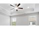 A stylish ceiling fan with lights adds comfort and elegance to the bedroom with two bright windows at 908 Catamaran Ct, Alpharetta, GA 30005
