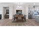 Dining area with an open floor plan, modern chandelier, next to the kitchen and fireplace at 908 Catamaran Ct, Alpharetta, GA 30005