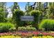 A beautifully landscaped entrance sign for Carvelle at Windward Park welcomes residents and visitors at 908 Catamaran Ct, Alpharetta, GA 30005