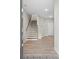 Bright foyer with beautiful stairs, light wood floors and white walls at 908 Catamaran Ct, Alpharetta, GA 30005