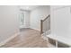 Bright foyer with wood floors and a white hall tree with hooks at 908 Catamaran Ct, Alpharetta, GA 30005