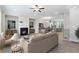 Inviting living space with an open floor plan, fireplace, and seamless flow to the kitchen and dining area at 908 Catamaran Ct, Alpharetta, GA 30005