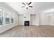 Bright living room featuring hardwood floors, fireplace, recessed lighting, and ceiling fan at 908 Catamaran Ct, Alpharetta, GA 30005