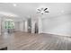 Open-concept living room with wood floors, recessed lighting and lots of space at 908 Catamaran Ct, Alpharetta, GA 30005