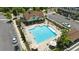Aerial view highlighting the crystal clear pool, sundeck, lounge area and verdant landscaping in a neighborhood setting at 908 Catamaran Ct, Alpharetta, GA 30005