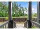 Beautiful outdoor view from porch shows trees, lush landscaping, and a privacy fence at 908 Catamaran Ct, Alpharetta, GA 30005