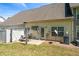 A well-maintained backyard with a patio set, a white fence, and green grass, perfect for outdoor relaxation at 949 Pike Forest Dr, Lawrenceville, GA 30045