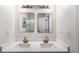 Bright bathroom with double vanity, quartz countertop, and stylish gold fixtures at 949 Pike Forest Dr, Lawrenceville, GA 30045
