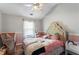 Cozy bedroom with a charming bed, themed decorations, and a chalkboard playhouse, ideal for a  at 949 Pike Forest Dr, Lawrenceville, GA 30045