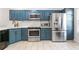 Kitchen with stainless steel appliances and custom cabinets at 949 Pike Forest Dr, Lawrenceville, GA 30045