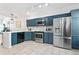 Kitchen area featuring stainless appliances and stylish cabinets at 949 Pike Forest Dr, Lawrenceville, GA 30045