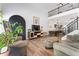 Open-concept living room featuring hardwood floors, modern decor, and natural light at 949 Pike Forest Dr, Lawrenceville, GA 30045