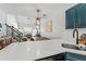 Open concept kitchen and living area with view to the staircase at 949 Pike Forest Dr, Lawrenceville, GA 30045