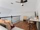 Cozy loft featuring hardwood floors, a comfortable couch, and a modern workspace at 949 Pike Forest Dr, Lawrenceville, GA 30045