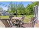 Inviting patio area features comfortable seating under a pergola and lush green surroundings, ideal for relaxing at 949 Pike Forest Dr, Lawrenceville, GA 30045