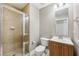Modern bathroom features a glass-enclosed shower with tiled walls and a vanity with a sink and storage at 171 Auburn Ne Ave # 210, Atlanta, GA 30303