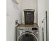Convenient laundry area with a front-load washer and dryer, plus space for storage at 171 Auburn Ne Ave # 210, Atlanta, GA 30303
