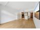 Open-concept living space with kitchen area, hard floors, and large TV at 171 Auburn Ne Ave # 210, Atlanta, GA 30303