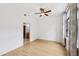 The main bedroom features hardwood floors, a ceiling fan, and large windows at 171 Auburn Ne Ave # 210, Atlanta, GA 30303