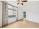 Main bedroom featuring hardwood floors, a ceiling fan, and windows at 171 Auburn Ne Ave # 210, Atlanta, GA 30303