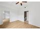 Main bedroom featuring hardwood floors, a ceiling fan, and an ensuite bathroom at 171 Auburn Ne Ave # 210, Atlanta, GA 30303