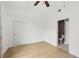 Main bedroom featuring hardwood floors, a ceiling fan, and a closet at 171 Auburn Ne Ave # 210, Atlanta, GA 30303