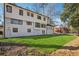 Expansive backyard with lush green grass, woods and a brick house at 335 Amberidge Nw Trl, Atlanta, GA 30328