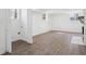 Unfinished basement featuring wood-look flooring and white walls with fireplace at 335 Amberidge Nw Trl, Atlanta, GA 30328