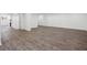 The finished basement has wood flooring with open space, white trim, and access to upper floors at 335 Amberidge Nw Trl, Atlanta, GA 30328