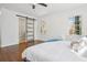 Bedroom featuring hardwood floors, sliding door, and two windows at 335 Amberidge Nw Trl, Atlanta, GA 30328