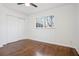 Bedroom featuring hardwood floors, a ceiling fan, and a large window at 335 Amberidge Nw Trl, Atlanta, GA 30328