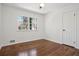 Bright bedroom with hardwood floors, a window, and ample natural light at 335 Amberidge Nw Trl, Atlanta, GA 30328