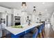 Bright kitchen with island seating, stainless steel appliances and custom cabinetry at 335 Amberidge Nw Trl, Atlanta, GA 30328