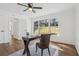 Office features hardwood floors, large windows, ceiling fan, and white walls at 335 Amberidge Nw Trl, Atlanta, GA 30328
