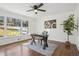 Bright office space with dark hardwood floors, ceiling fan, and large window at 335 Amberidge Nw Trl, Atlanta, GA 30328
