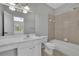 Bright bathroom featuring a double vanity sink with a shower and bath combo at 11180 West Rd, Roswell, GA 30075