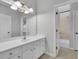 Bright bathroom with double vanity sink and bath tub at 11180 West Rd, Roswell, GA 30075