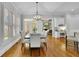 Elegant dining room with hardwood floors, shutters and natural light at 11180 West Rd, Roswell, GA 30075