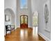 Grand foyer features a high ceiling, hardwood floors, and arched doorways at 11180 West Rd, Roswell, GA 30075